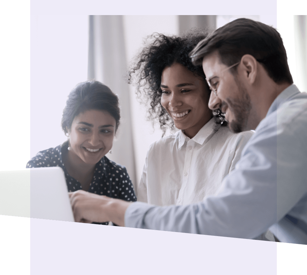 Three people looking at a laptop