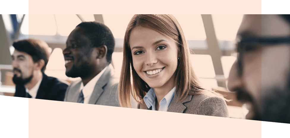 Woman smiling at the camera during a meeting